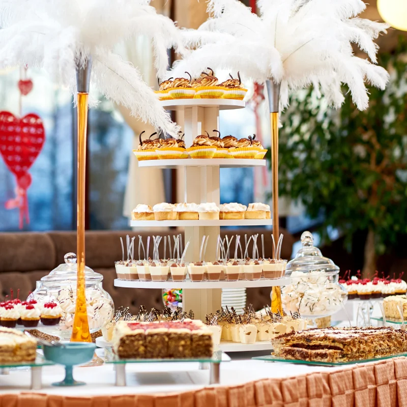 restaurant table with plenty different tasty desserts cupcakes creamy cakes sweet sugar eating cafe celebration concept